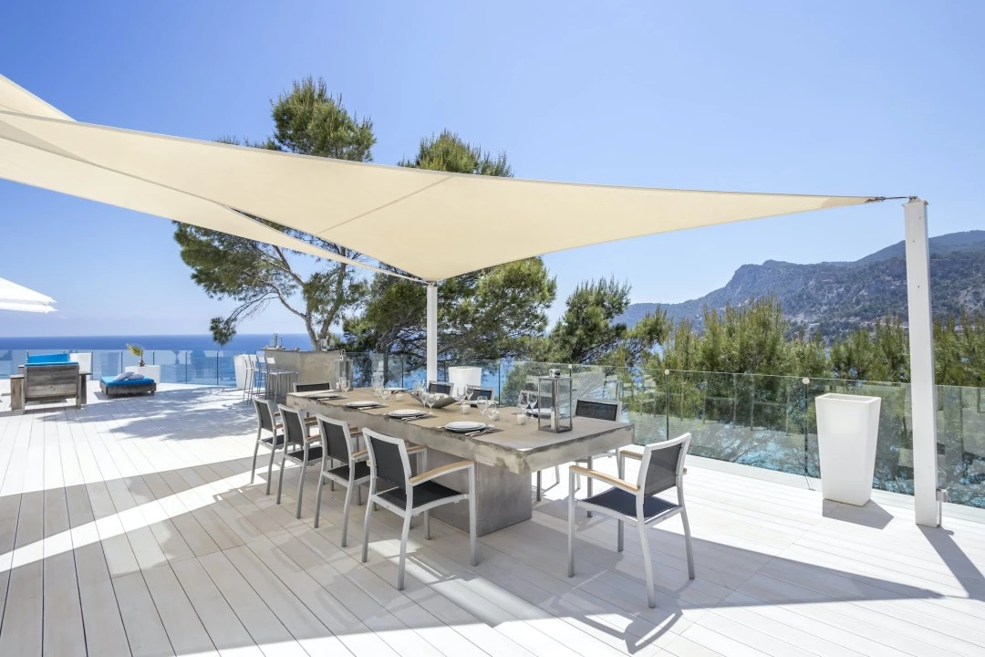 1681216596-Luxury real estates Ibiza to rent villa Raya Outside dining table 1 .webp